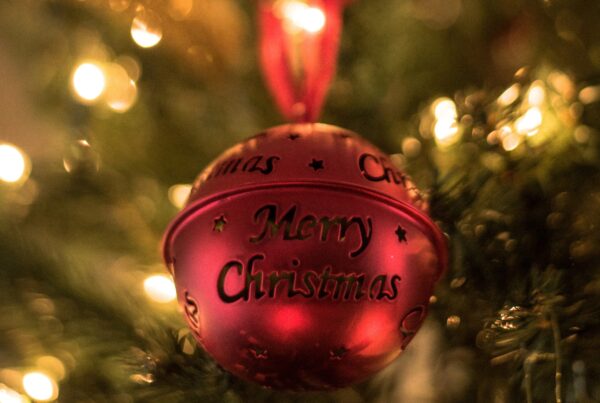 Red Christmas ball with “Merry Christmas” engraving