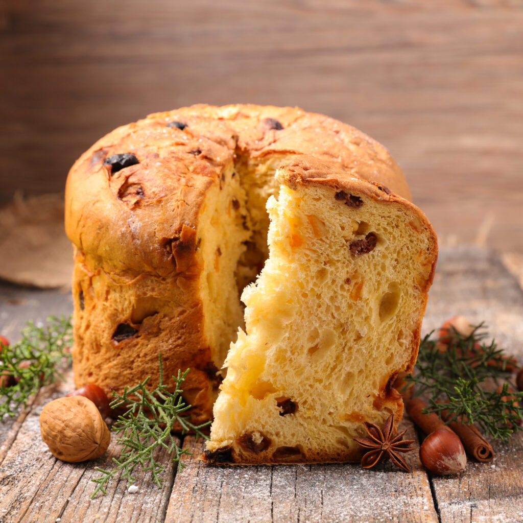 Panettone or Italian Christmas Bread is a sponge-like bread enriched with a mix of dried raisins, citron, candied orange and chopped almonds. 